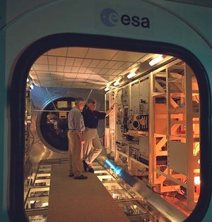 ESA astronaut Ulf Merbold checks out the Biolab glovebox