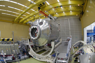 Columbus laboratory is lowered into container ahead of transportation to Florida