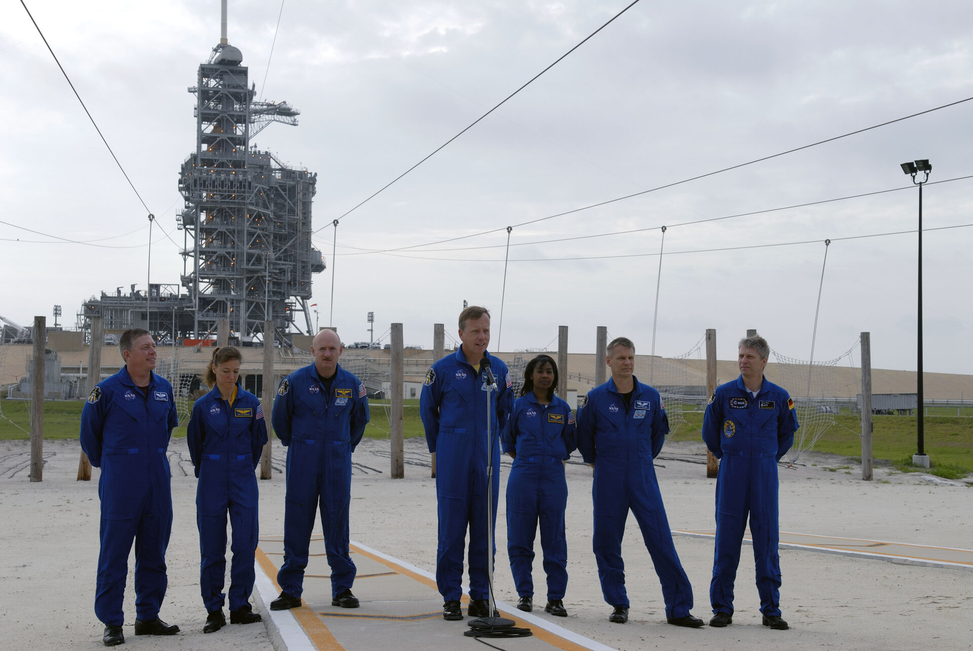 STS-121 crew pose for the media