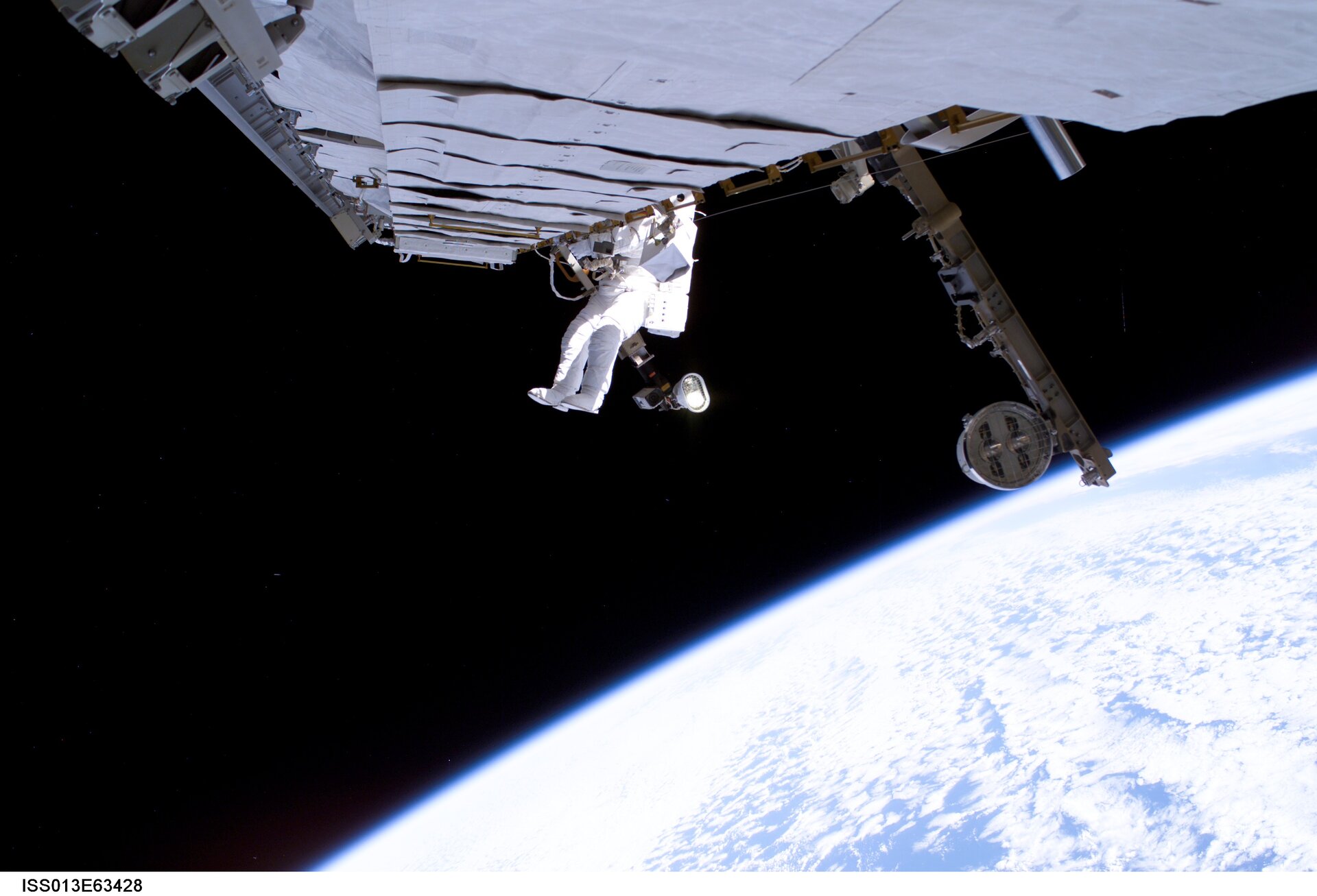 Thomas Reiter works on a cooling line of the International Space Station