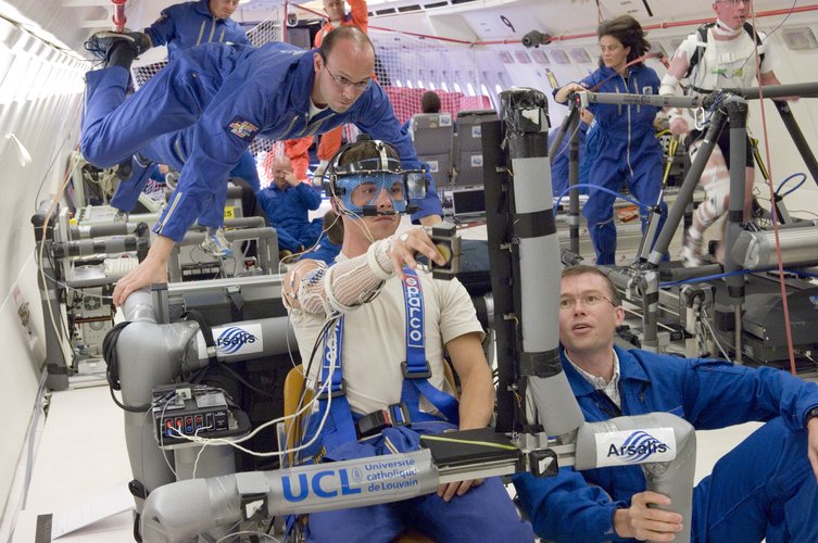 The team of the Catholic University of Louvain conducting the experiment on dextrous manipulation