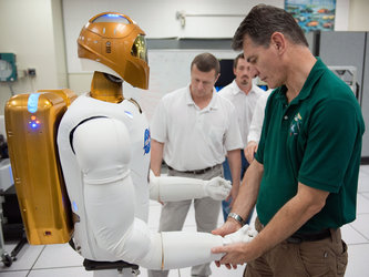 Paolo Nespoli with a Robonaut