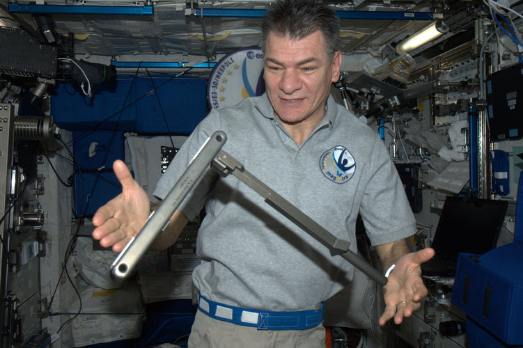 Paolo Nespoli with a can crusher