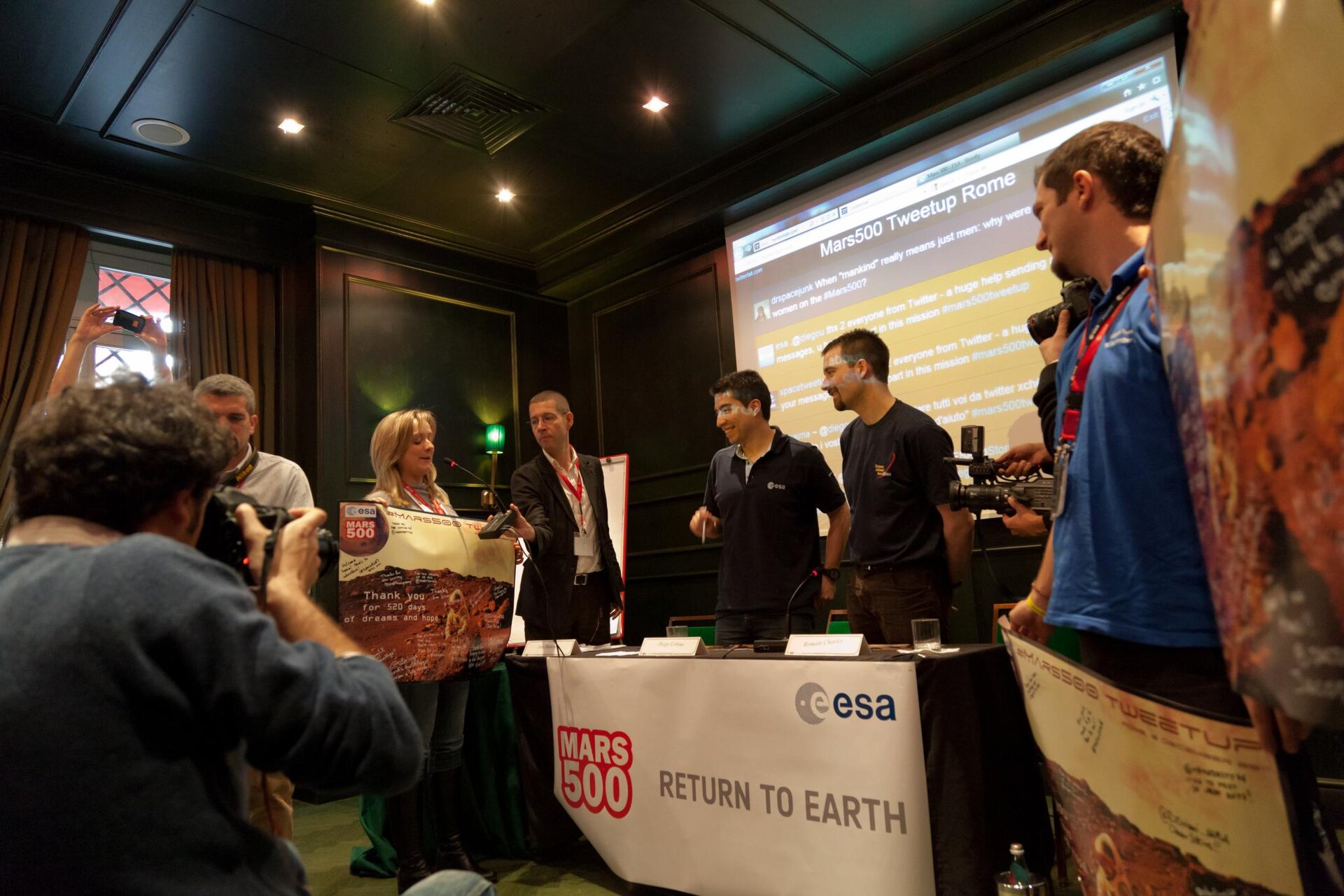 Romain Charles and Diego Urbina receiving posters