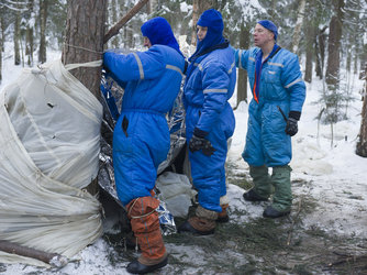 Building a shelter during winter survival training