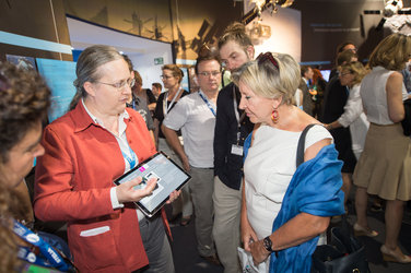 Isabelle Duvaux-Béchon shows Dominique Tilmans the ESA Pavilion