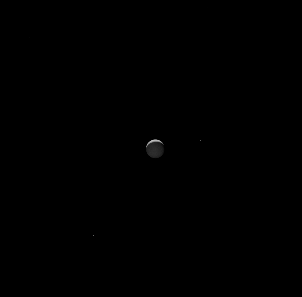 Enceladus setting behind Saturn