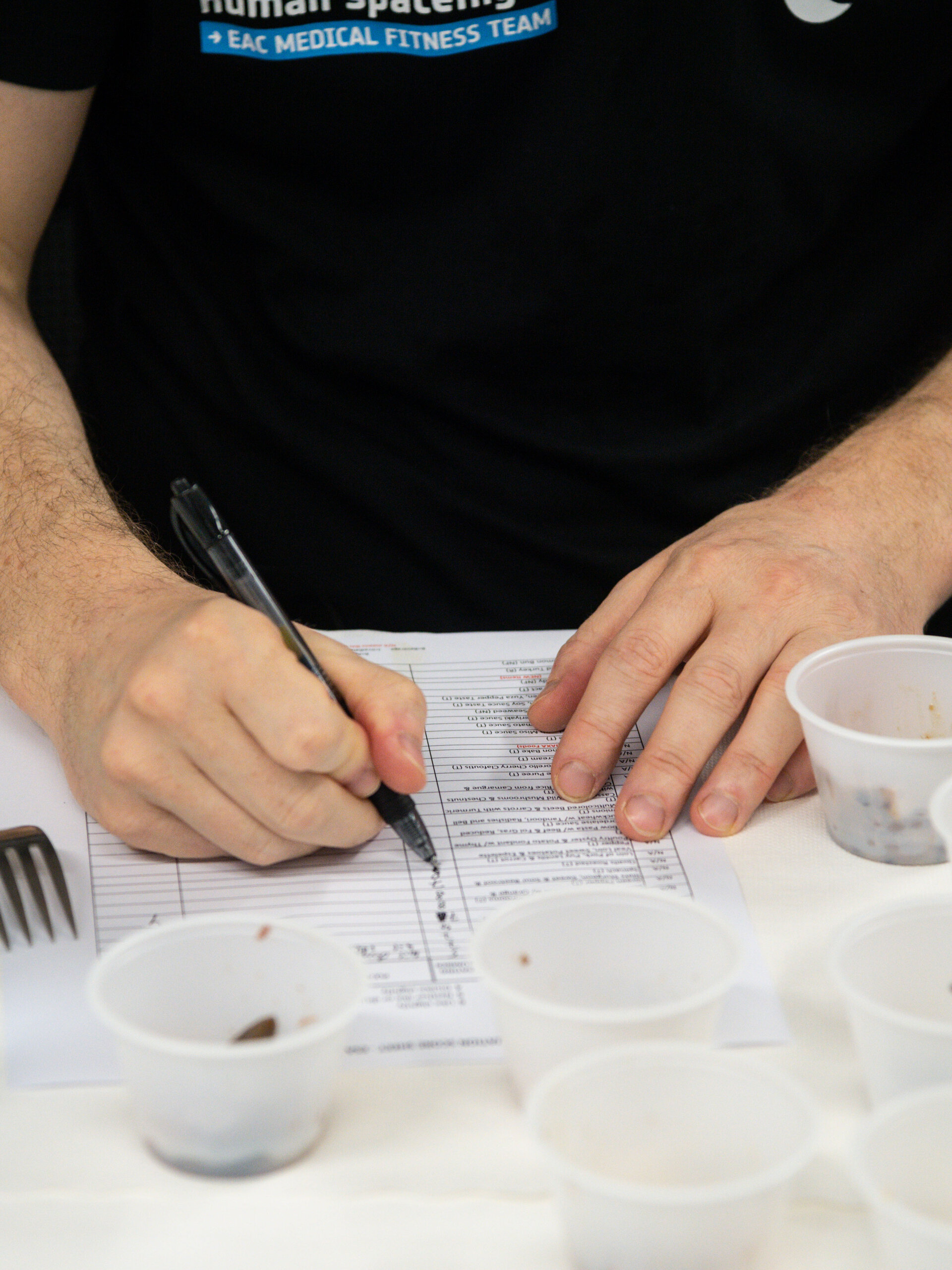Matthias Maurer filling out NASA space food tasting questionnaire