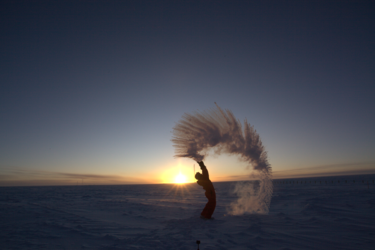Freezing boiling water in Concordia against the sunset