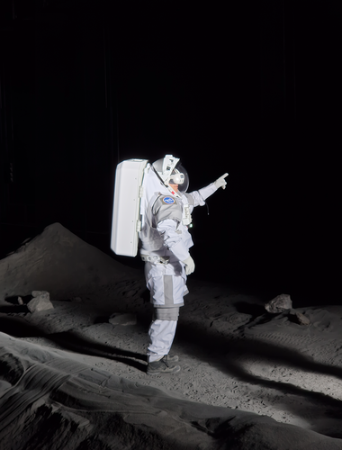 ESA astronaut Matthias Maurer tests a VR headset while wearing the ATLAS analogue suit inside the LUNA facility.