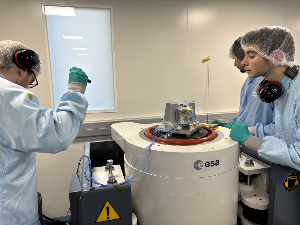 The students inspecting the payload after the test