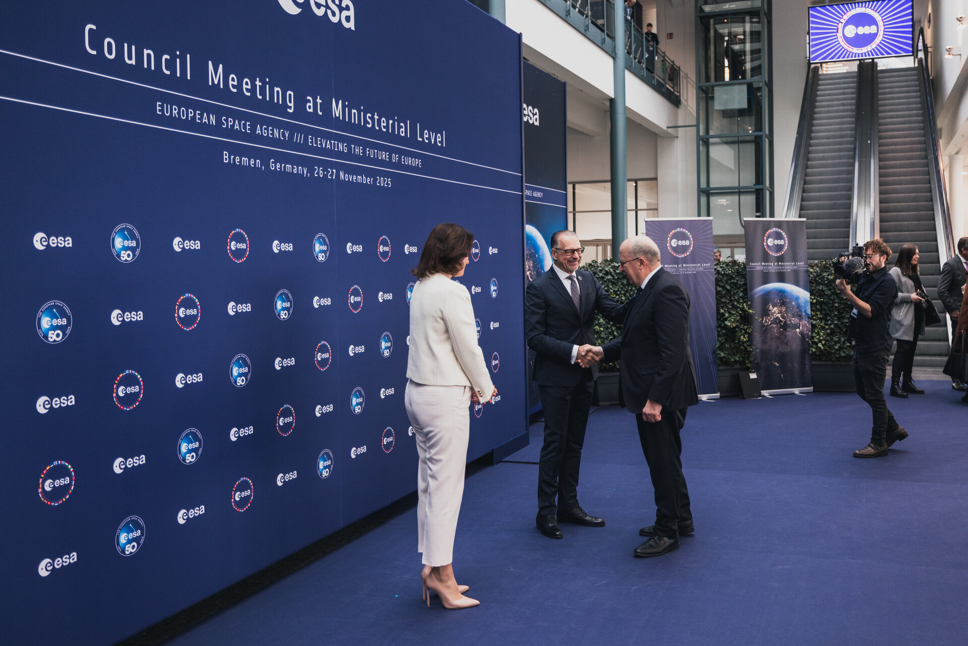 European Commissioner Andrius Kubilius is greeted by Dorothee Bär, Federal Minister of Research, Technology and Space, Germany and ESA Director General Josef Aschbacher.