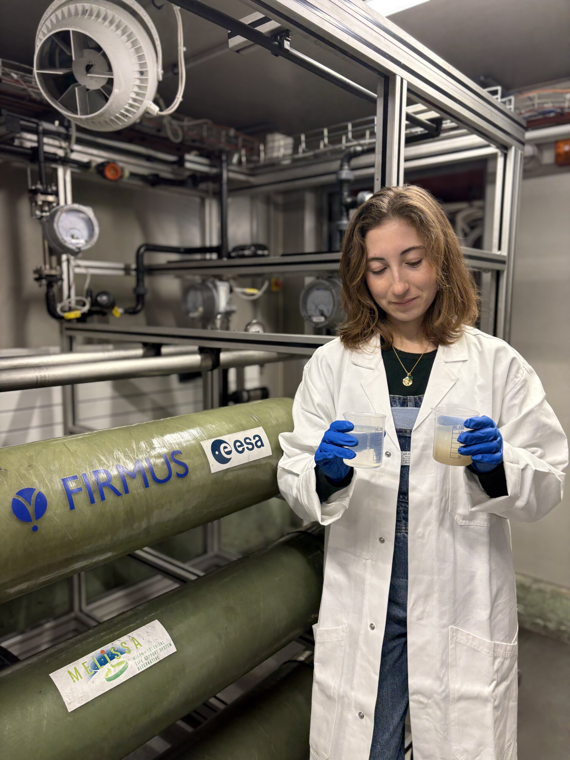 ESA medical doctor Sarah Gaier tests water from the recycling system at Concordia station in Antarctica